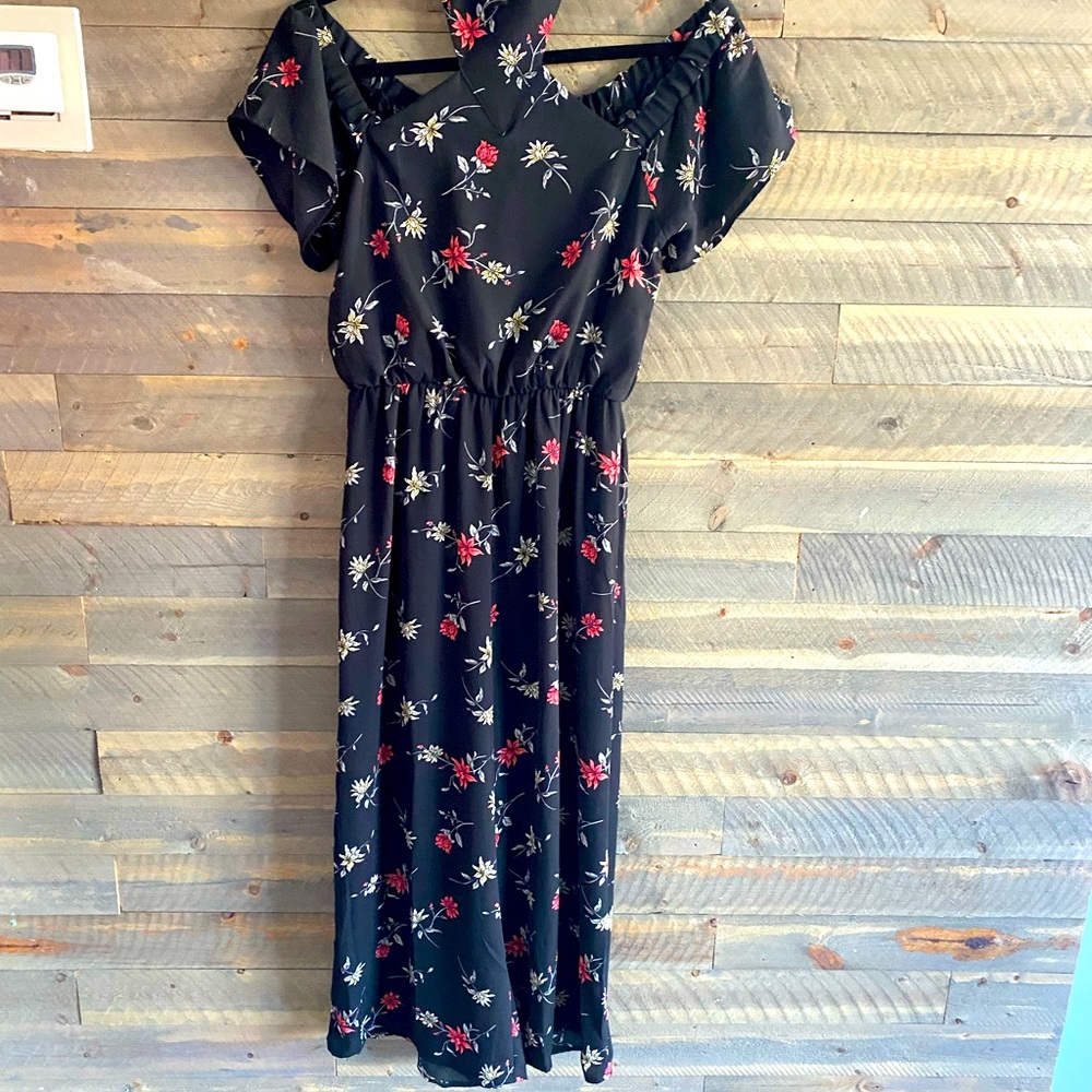 Sienna sky Black trendy romper with red flowers. Size small. Great condition
